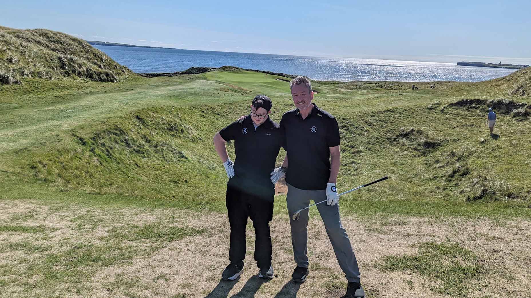 Michael B&eacute;rub&eacute; and his son, Jamie, at Lahinch.