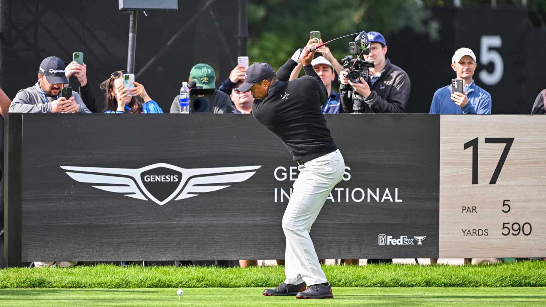 tiger woods swings driver on the 17th hole at riviera country club ahead of the 2024 genesis invitational