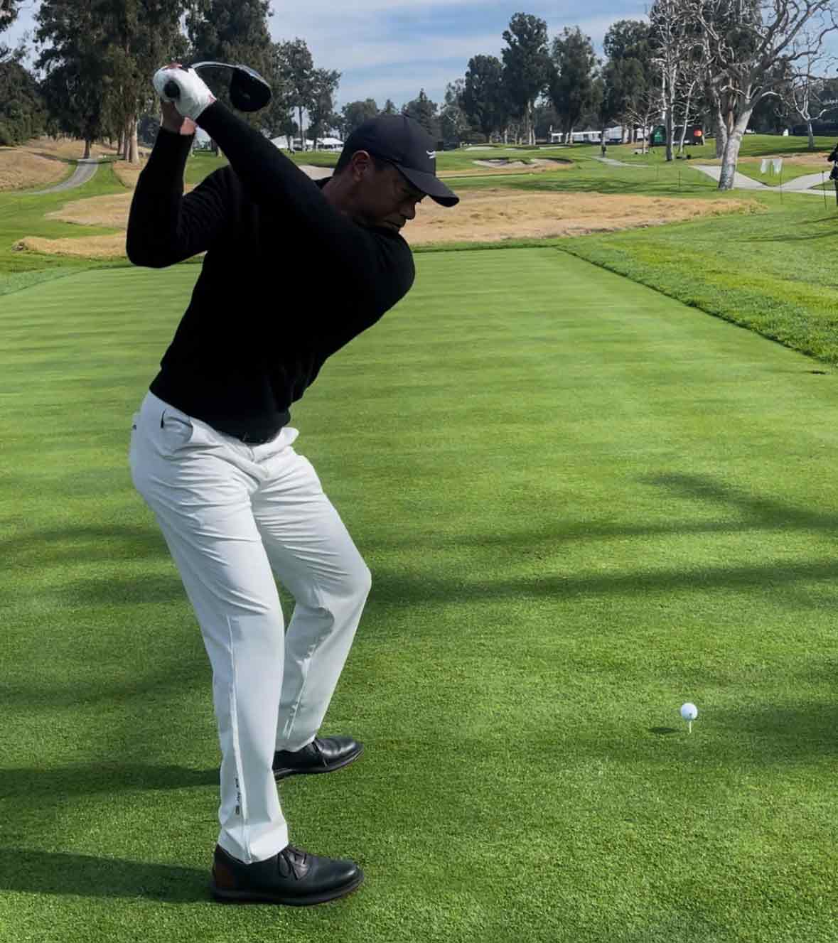 tiger woods swings during the genesis invitational