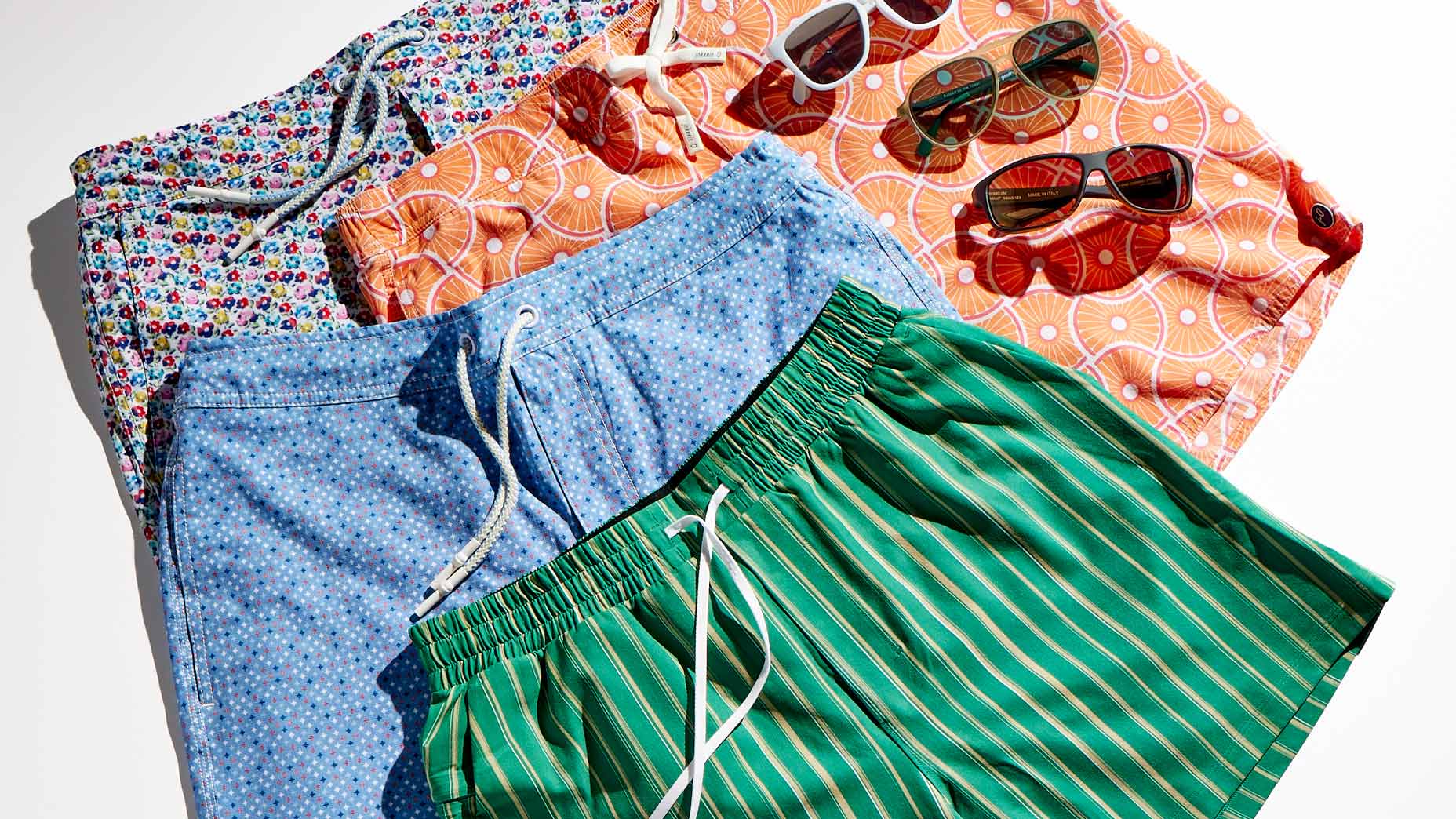 Suits, from top: johnnie-O Half Elastic Surf Short (Aries), $89; johnnie-O Half Elastic Surf Short (Belfaire), $89; johnnie-O Samet Vintage Surf Short, $89; Lululemon Pool Short, $78.