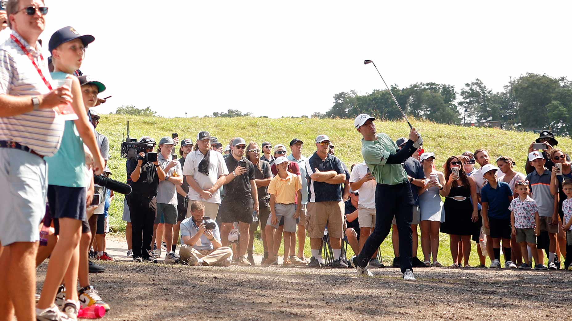 Max Greyserman hits his second shot on the par-5 18th during the final round of the 3M Open at TPC Twin Cities on Sunday.