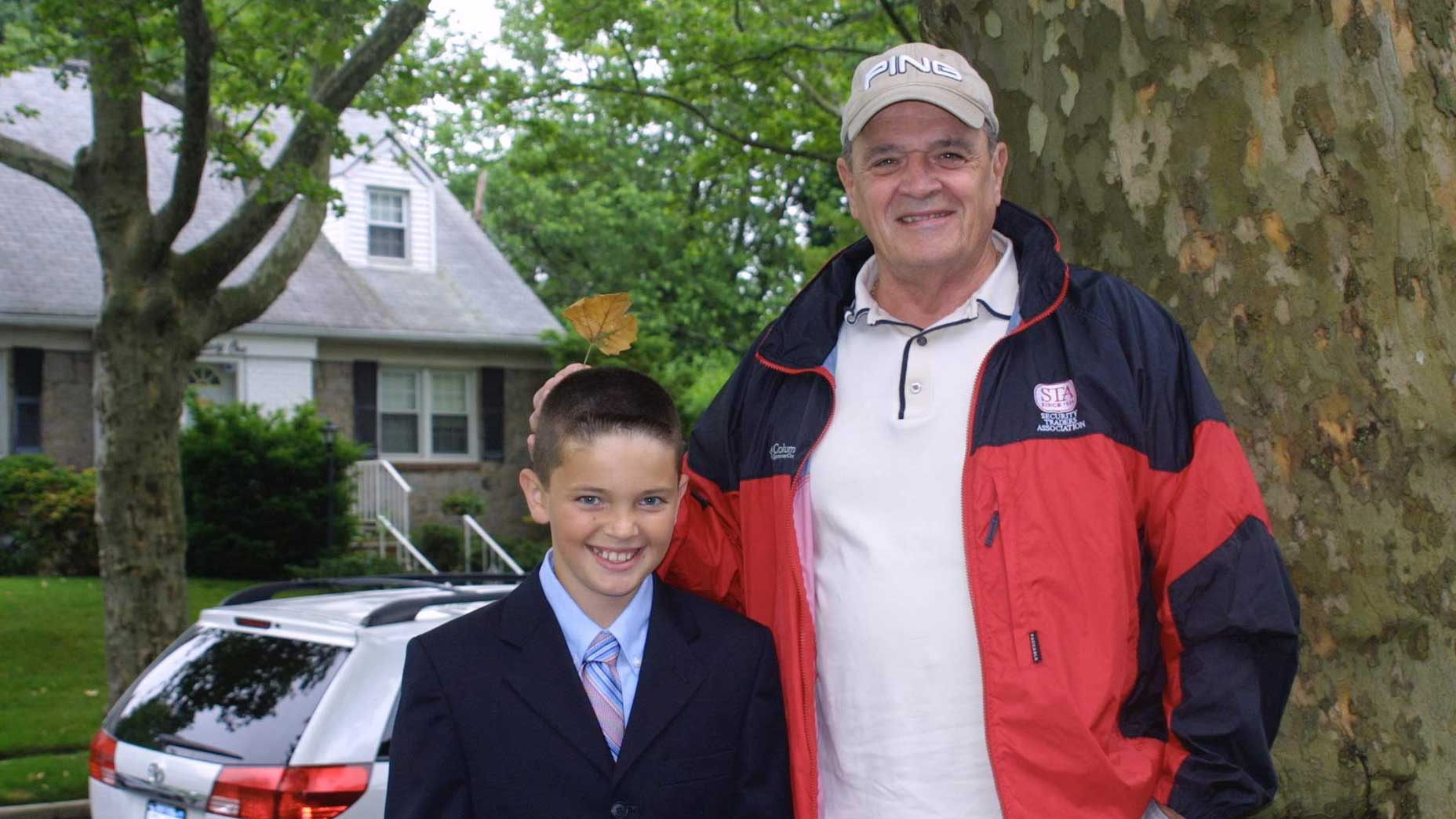 james colgan and joe boyle stand next to one another with a leaf behind james colgan's head