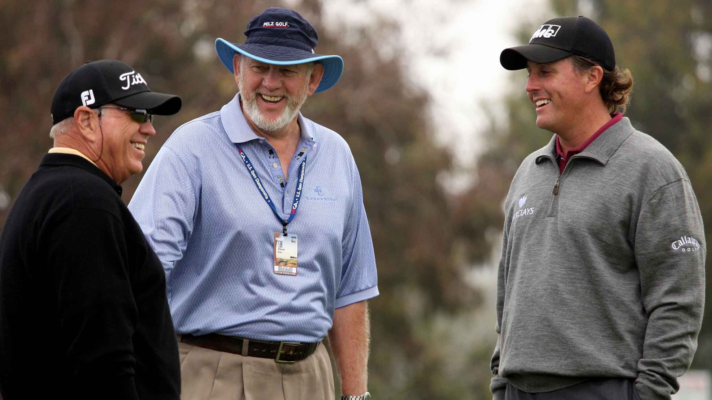 Butch Harmon (L) and Dave Pelz talk with Phil Mickelson during the second day of previews to the 108th U.S. Open at the Torrey Pines Golf Course