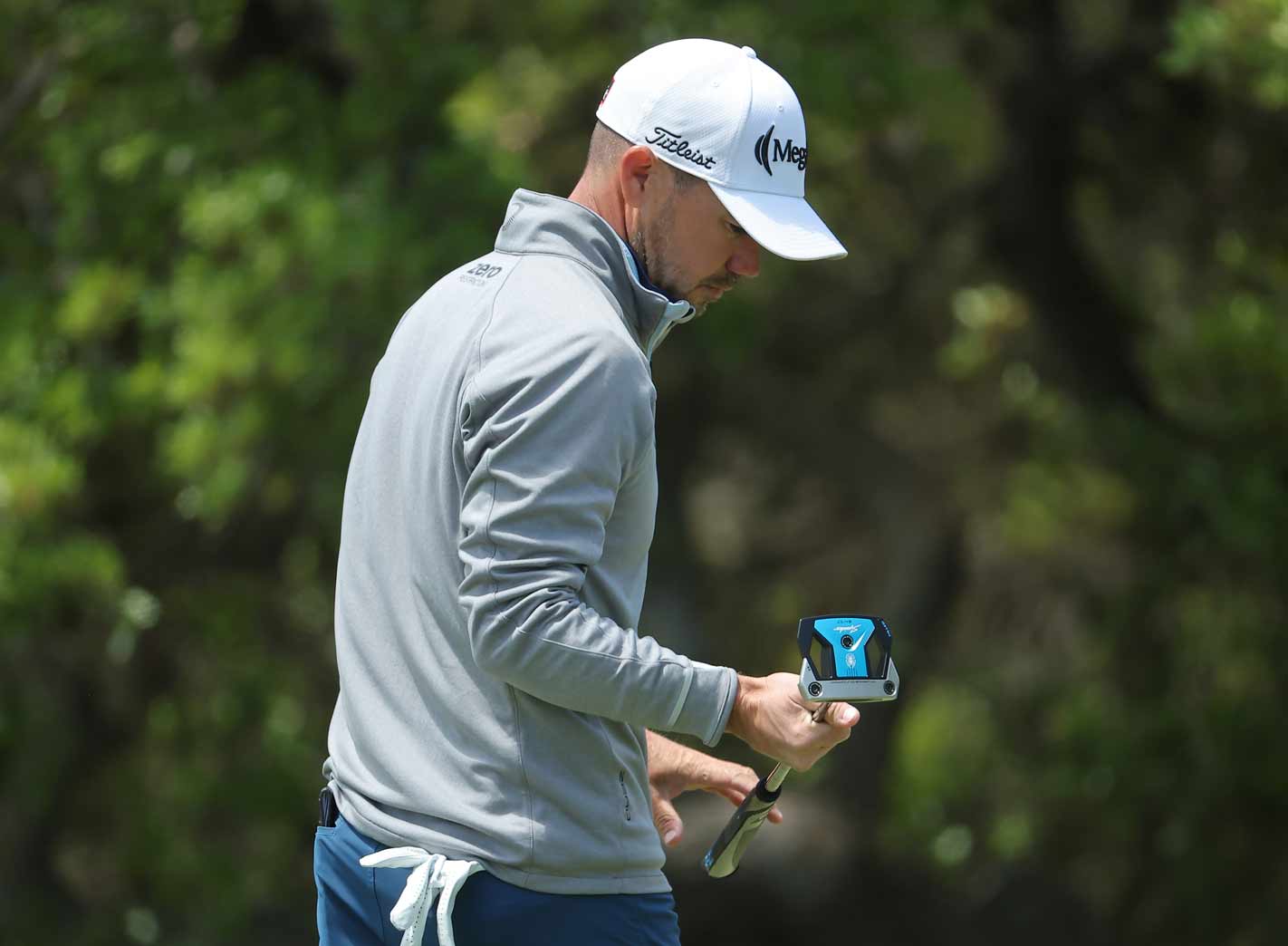 Brian Harman looks at his putter at the Texas Open.