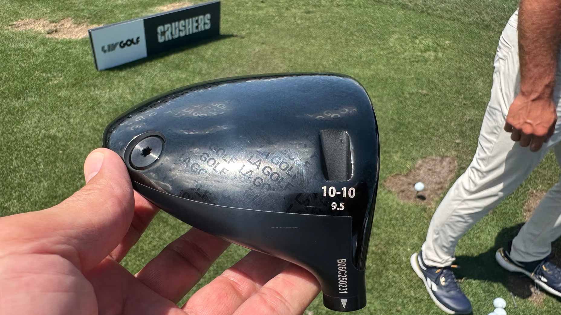 An LA Golf driver in-hand photo at golf course