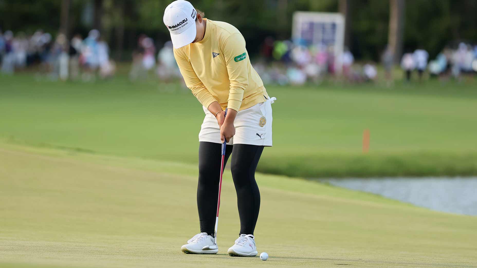 Mao Saigo putts on the 18th green at the Chevron Championship.