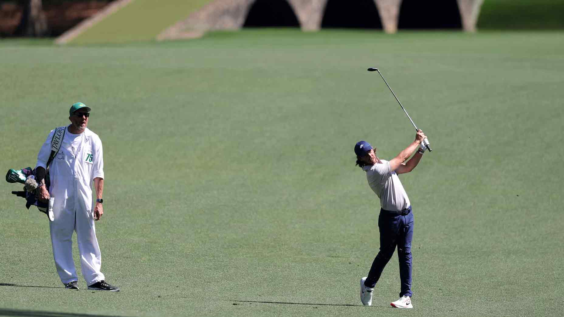 Tommy Fleetwood hits a 9-wood into the Par 5 13th at Augusta National