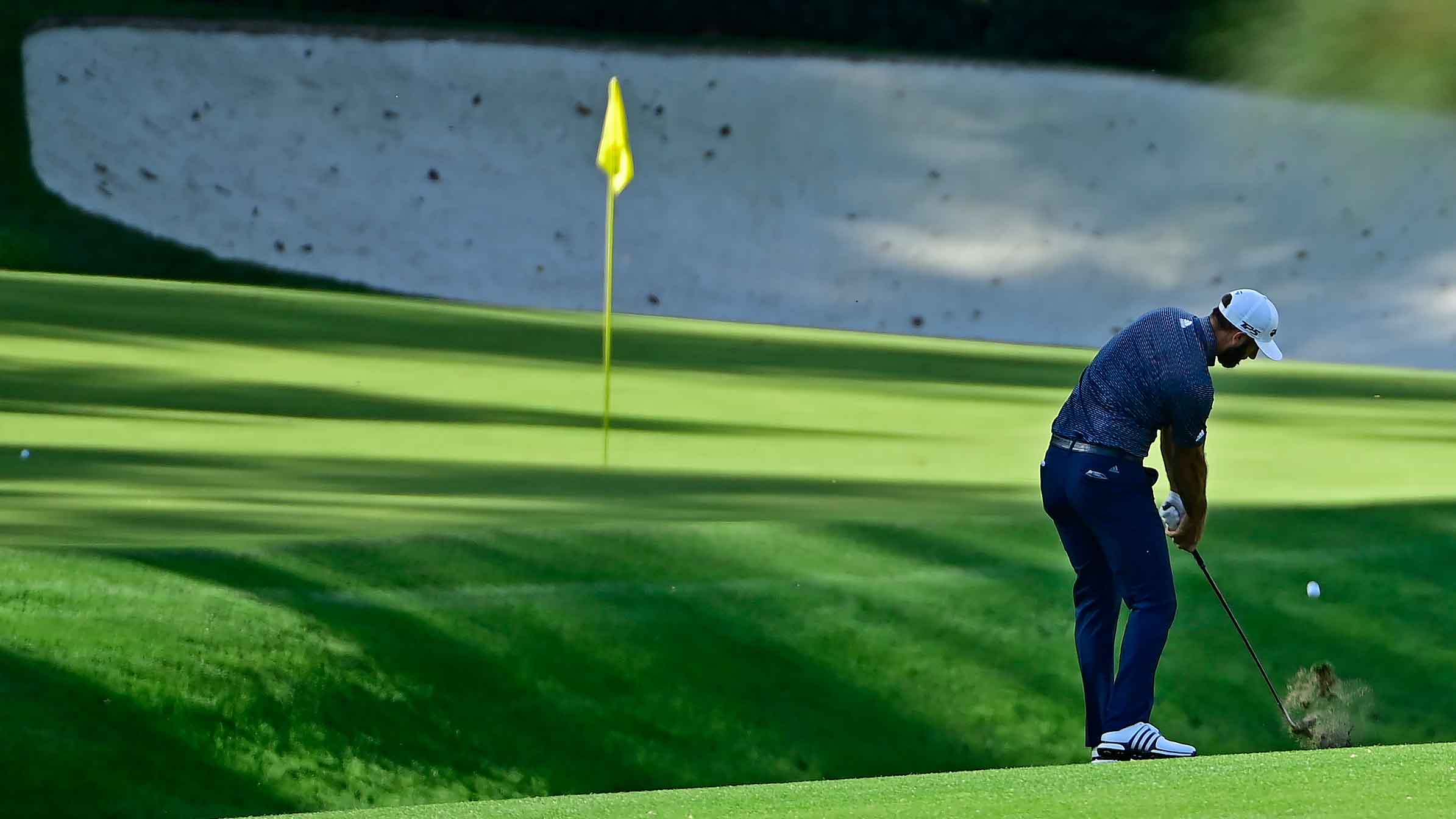 Dustin Johnson chips to the No 13 green during Round 4 of the Masters at Augusta National Golf Club, Sunday, November 15, 2020