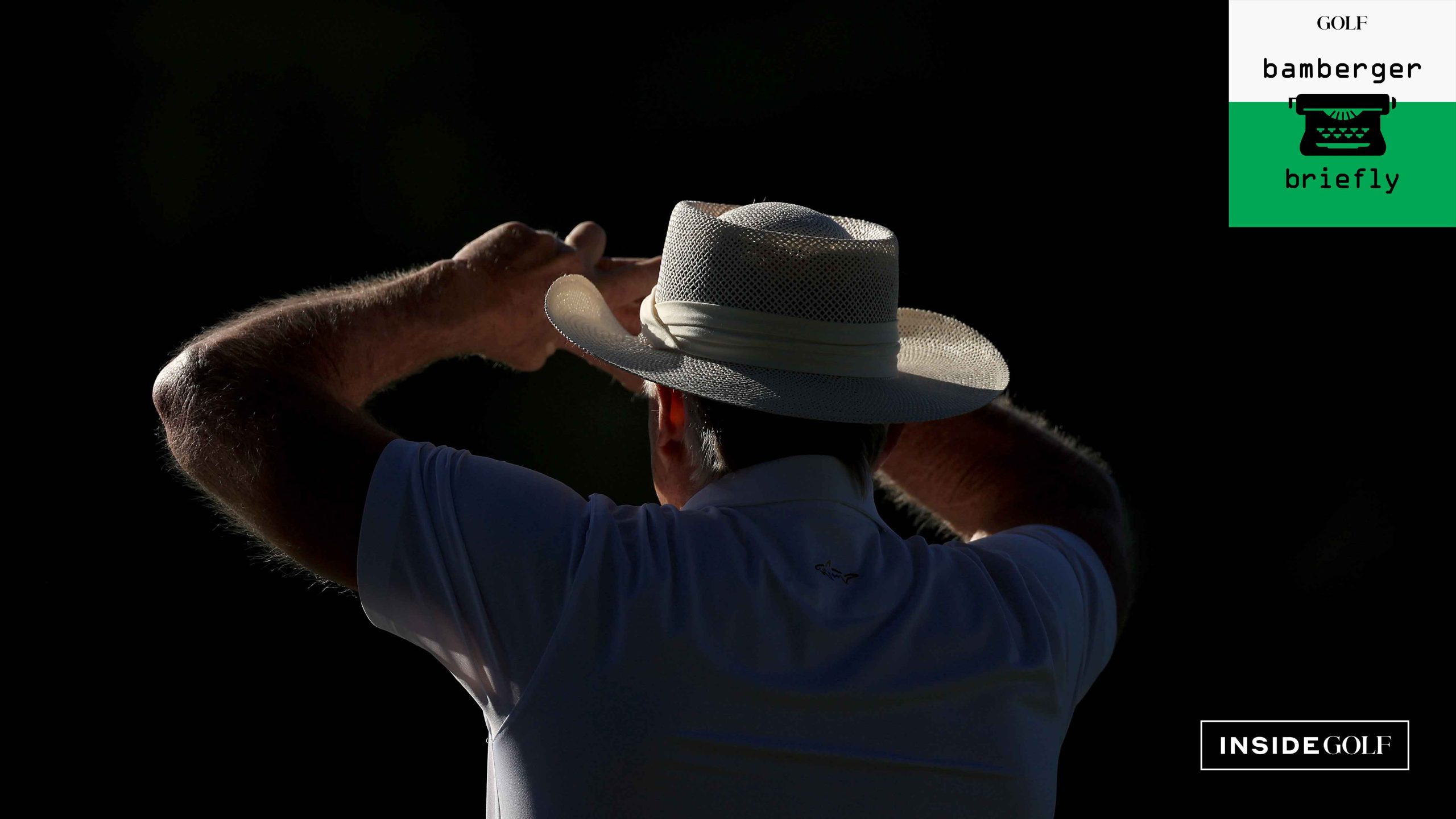 Greg Norman of Australia The Commissioner of The LIV Golf Tour watching some of his players in amongst the patrons during the completion of the weather delayed first round of the 2024 Masters Tournament