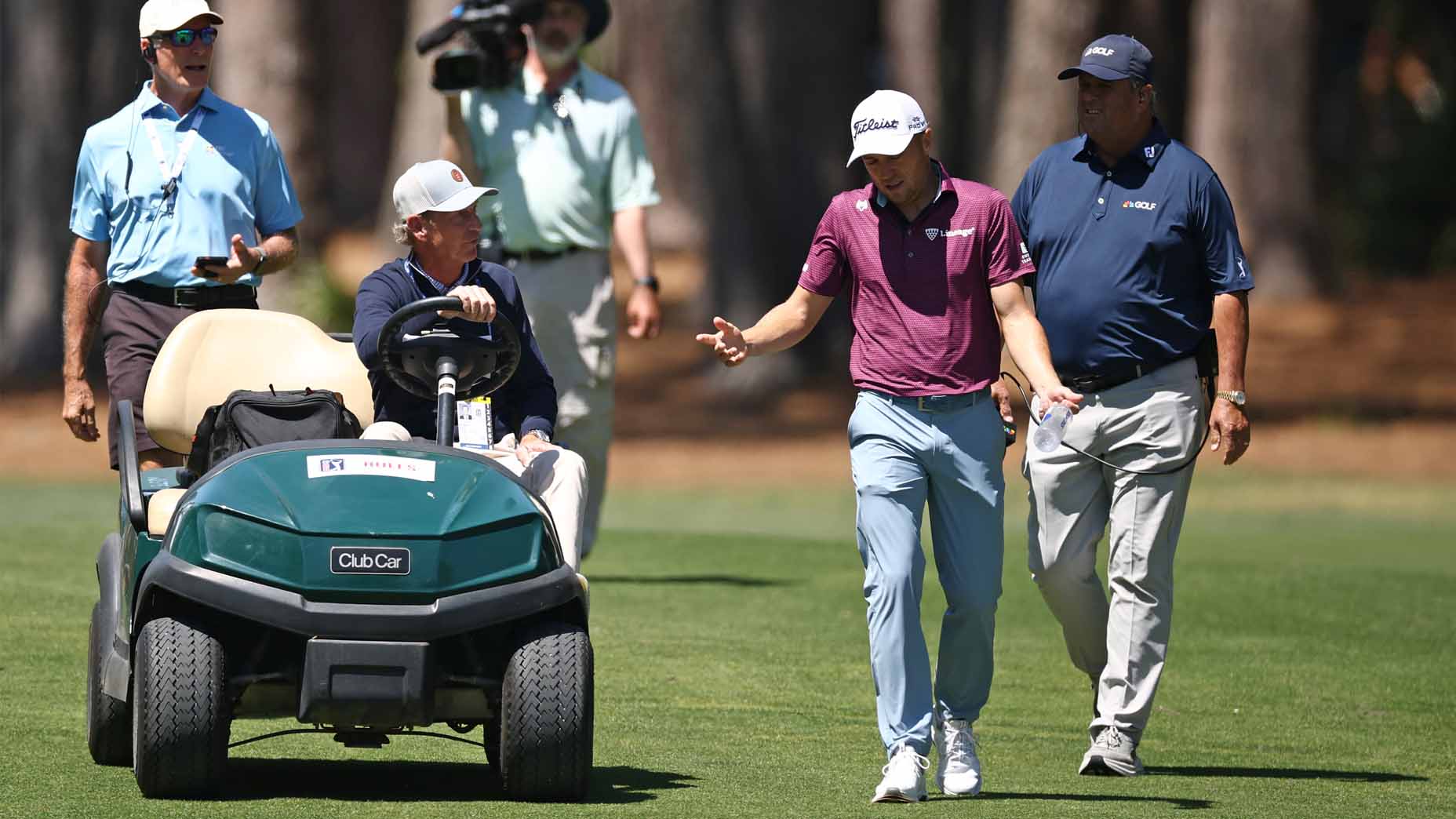 Justin Thomas talks with a rules official during the third round of the RBC Heritage.