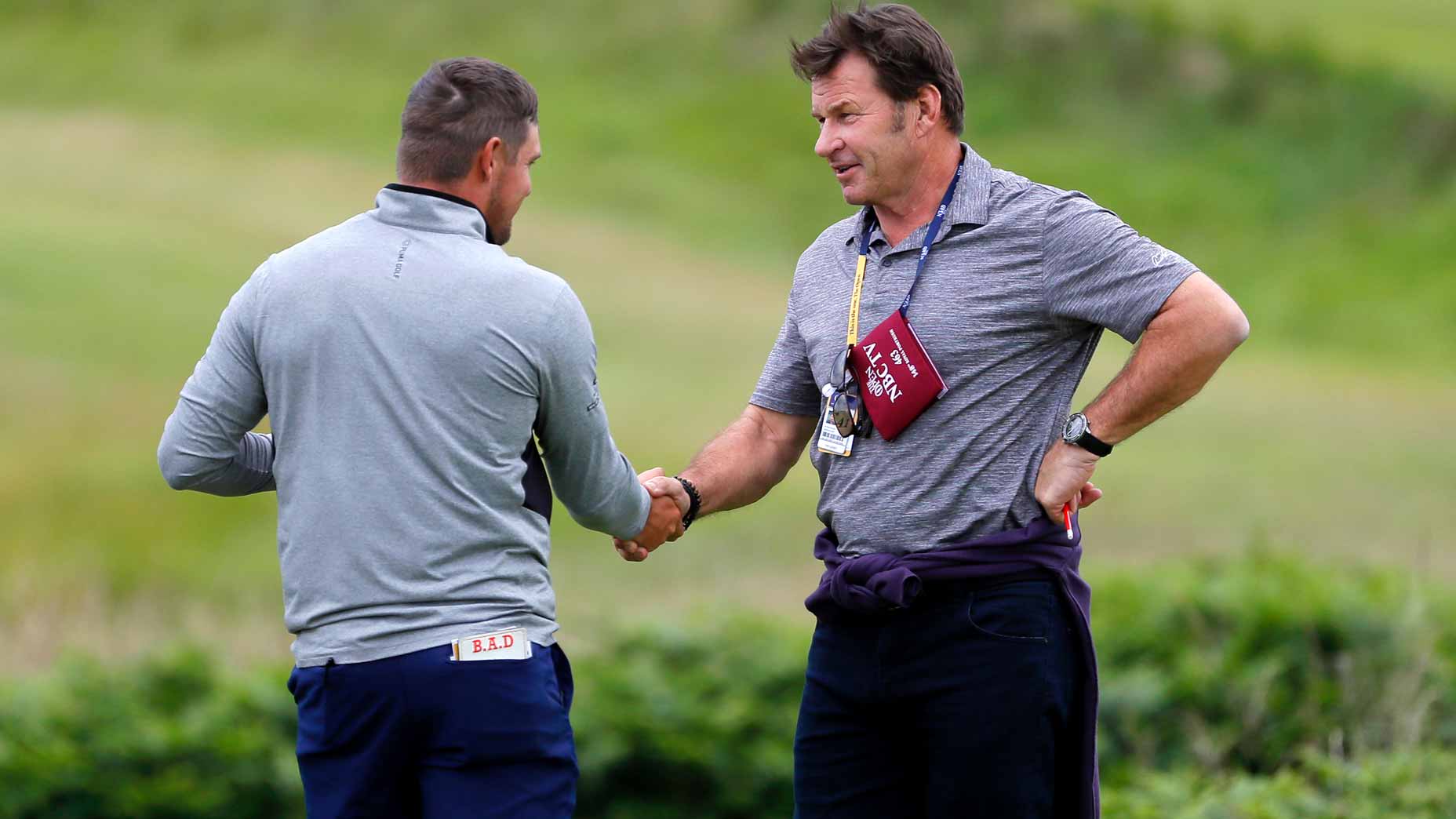 Nick Faldo shakes hands with Bryson DeChambeau prior to the 2019 Open Championship held on the Dunluce Links at Royal Portrush.