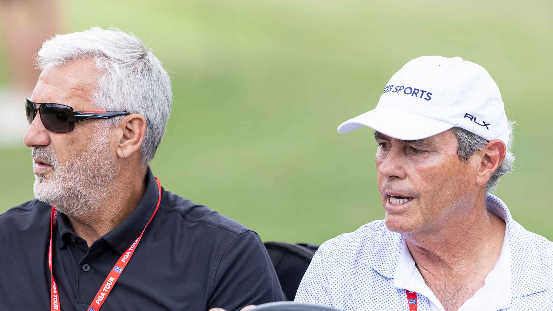 frank nobilo and ian baker finch ride in a golf cart together at the CJ Cup Byron Nelson