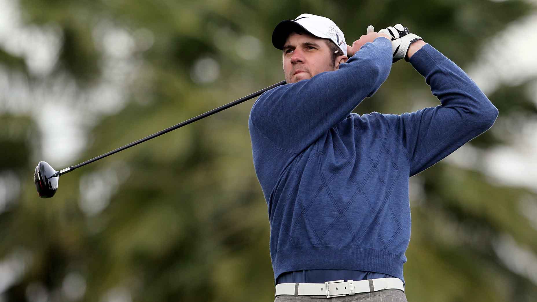 Former NLF QB Derek Anderson hits a tee shot on the 13th hole during the first round of the Bob Hope Classic.