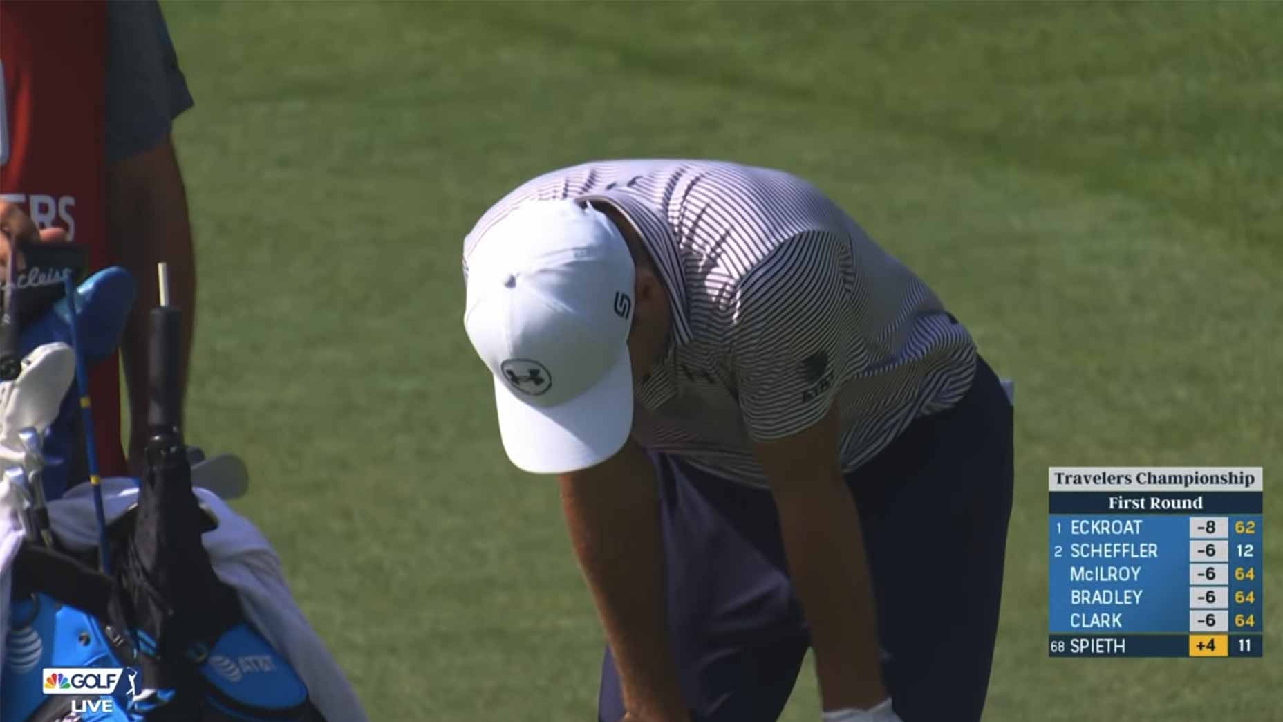 Jordan Spieth winces in pain.