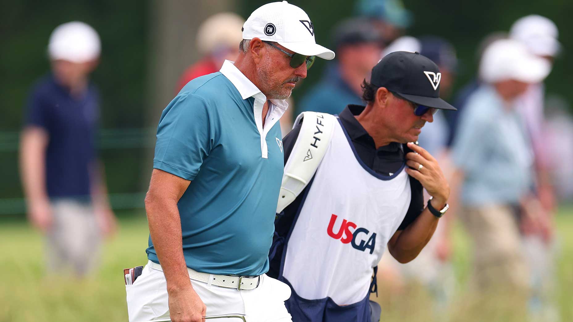 Phil mickelson and his caddie at the us open on friday
