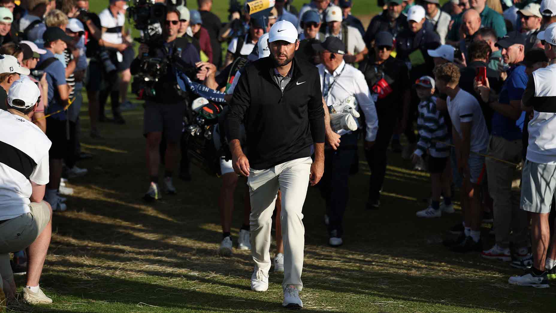 US golfer Scottie Scheffler walks to the 18th tee on day three of the 153rd Open Championship at Royal Portrush golf club in Northern Ireland on July 19, 2025.