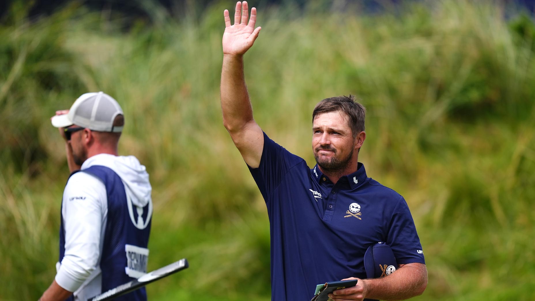 bryson dechambeau waves to the crowd on sunday at the open championship at royal portrush