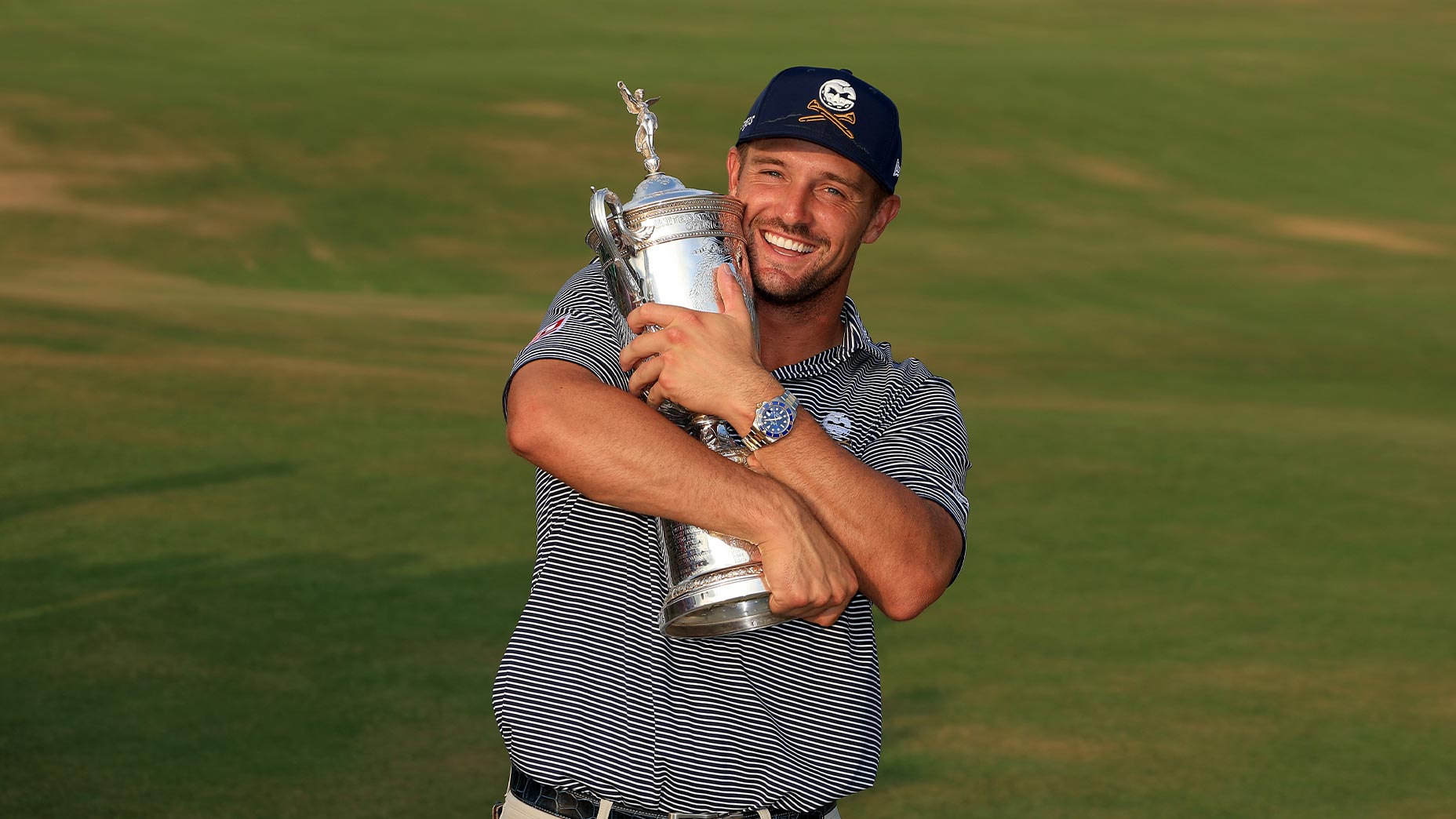 bryson dechambeau holds us open trophy at pinehurst