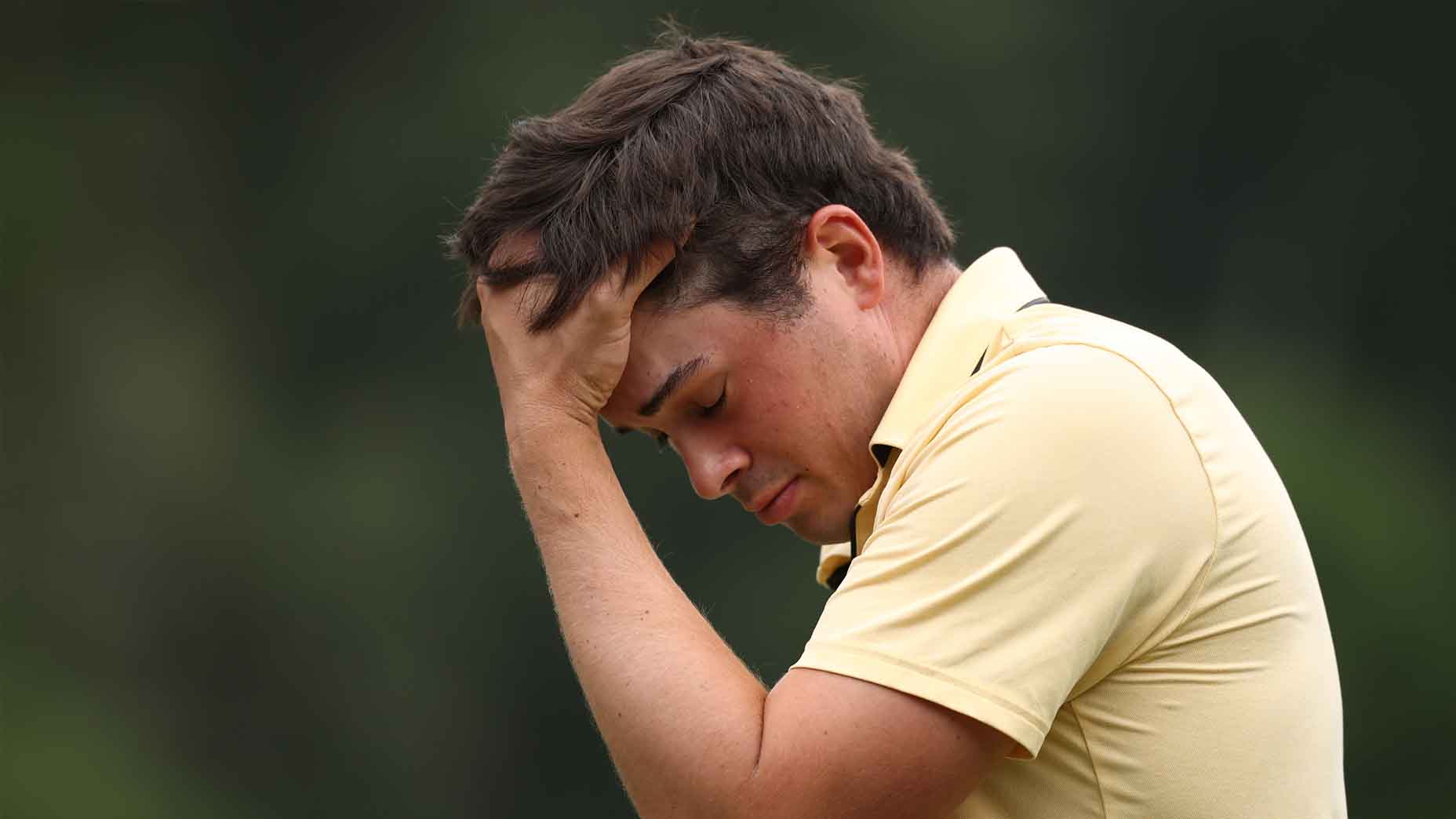 Davis Thompson reacts to a bogey on the 18th hole at the Wyndham Championship