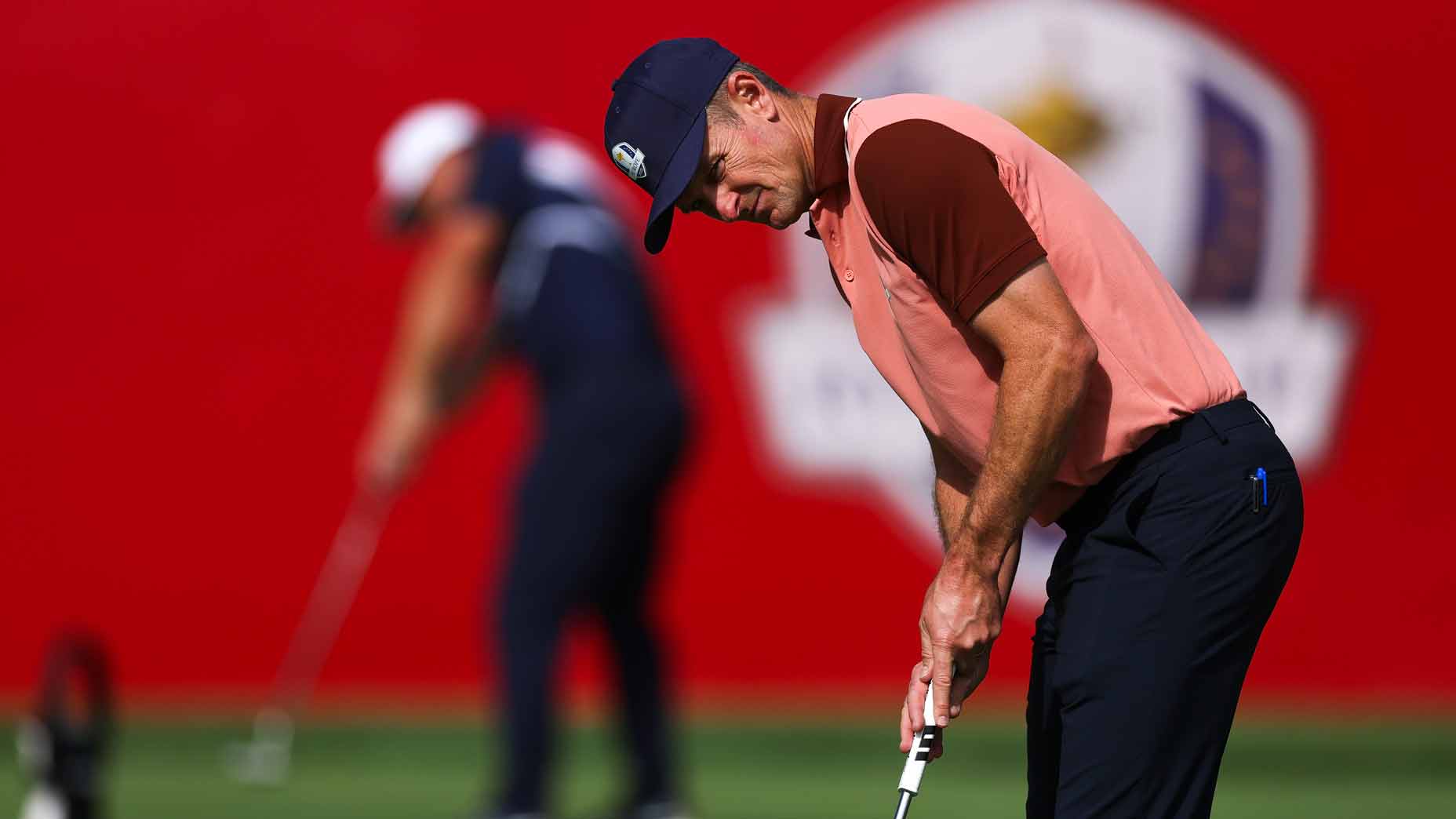 Justin Rose of Team Europe putts on the practice putting