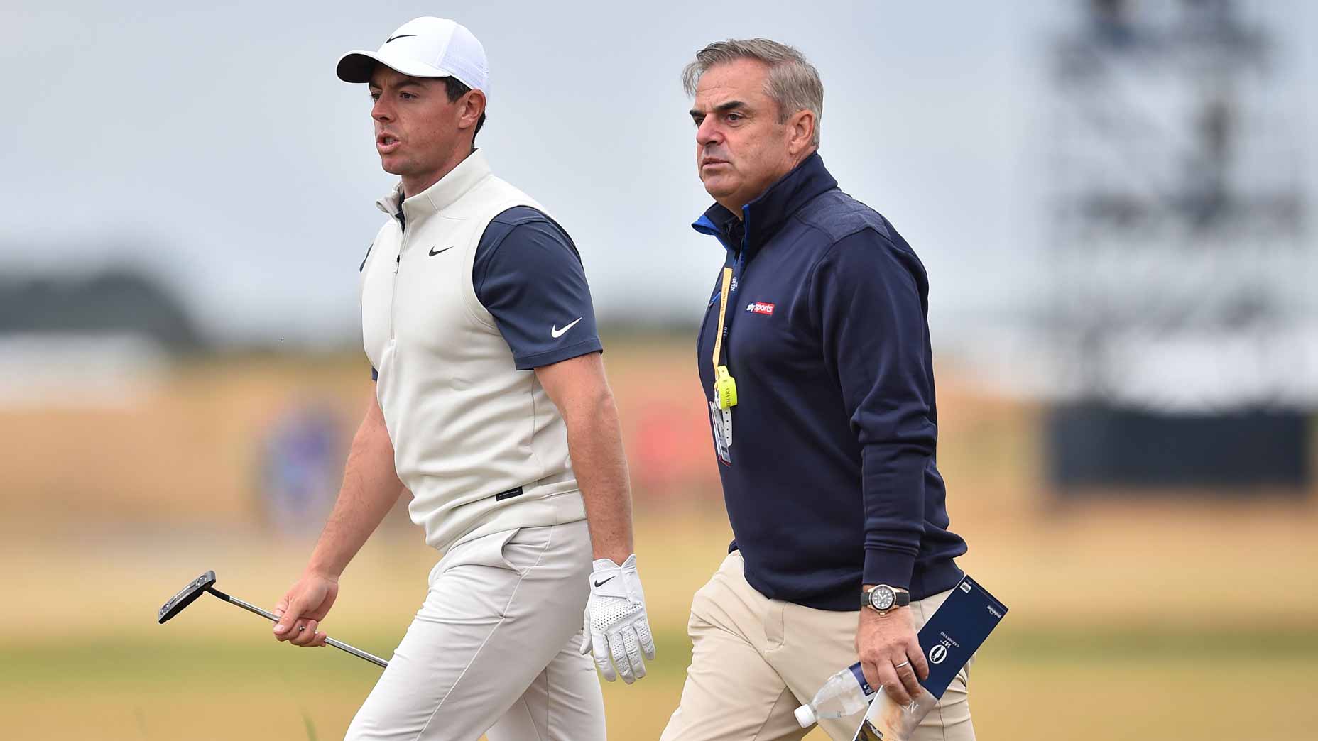 Rory McIlroy chats with former European Ryder Cup captain Paul McGinley during the 2018 Open Championship.