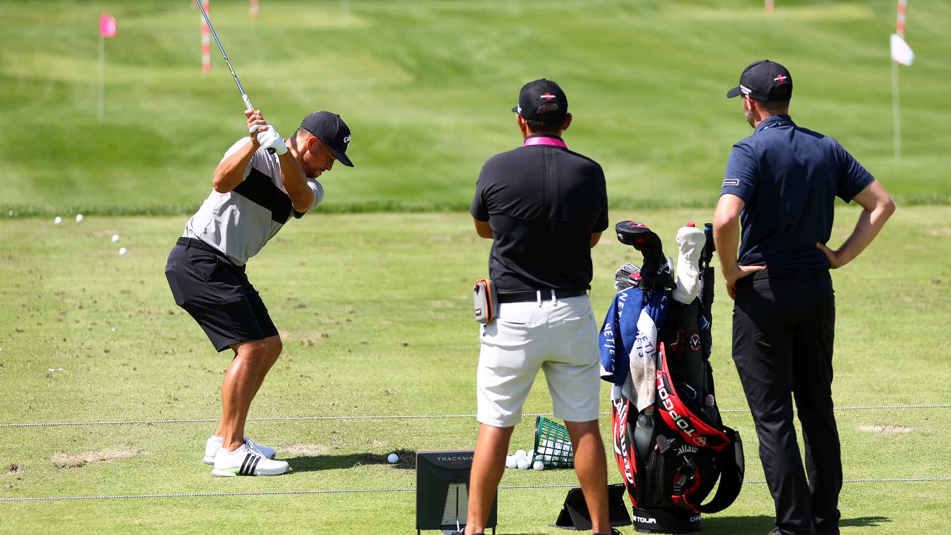 Xander Schauffele of the United States plays a shot on the driving range during a practice round prior to the 2024 PGA Championship at Valhalla Golf Club on May 13, 2024 in Louisville, Kentucky.