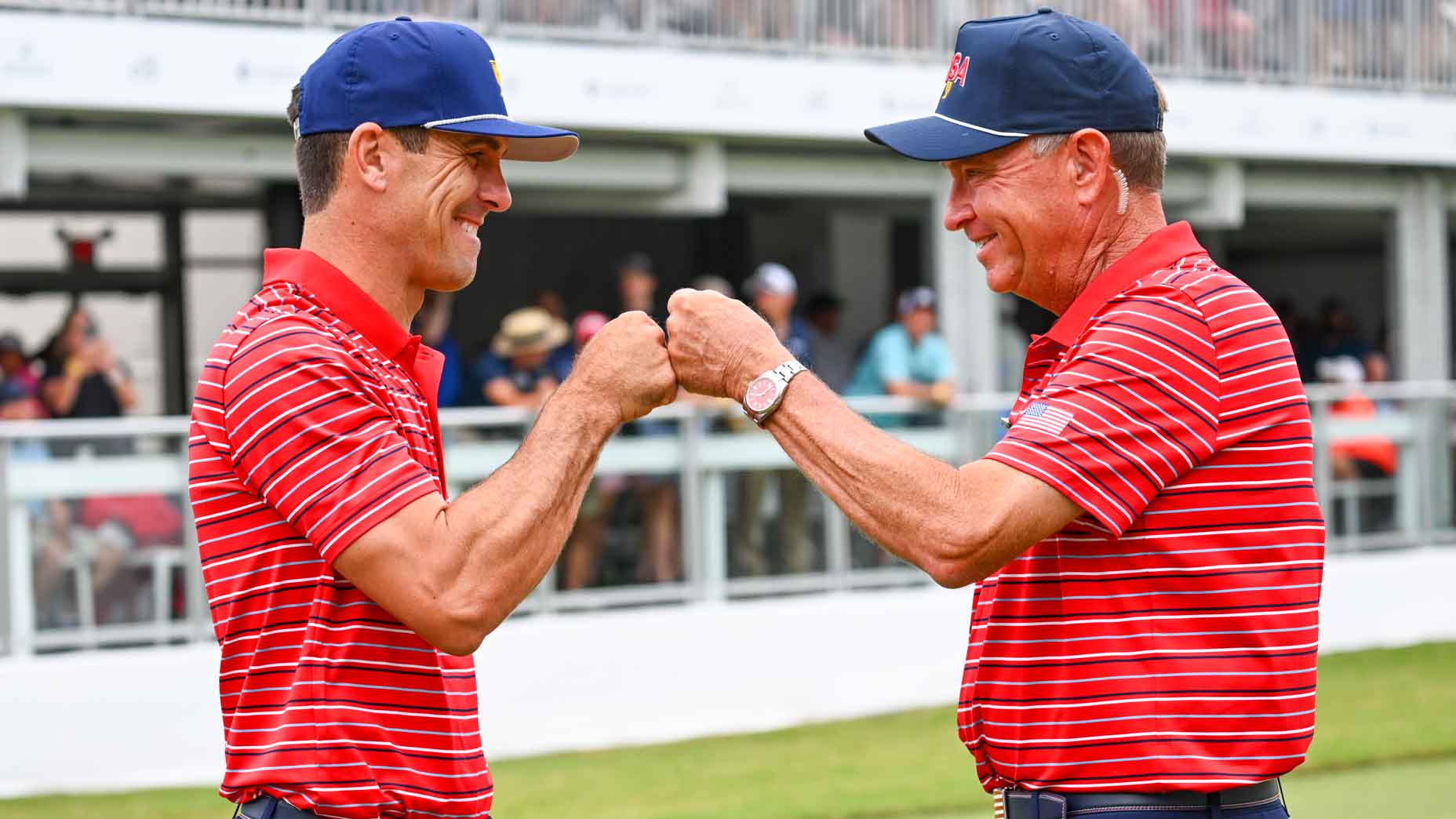 Former U.S. Ryder Cup captain Davis Love III greets Billy Horschel during the 2022 Presidents Cup.