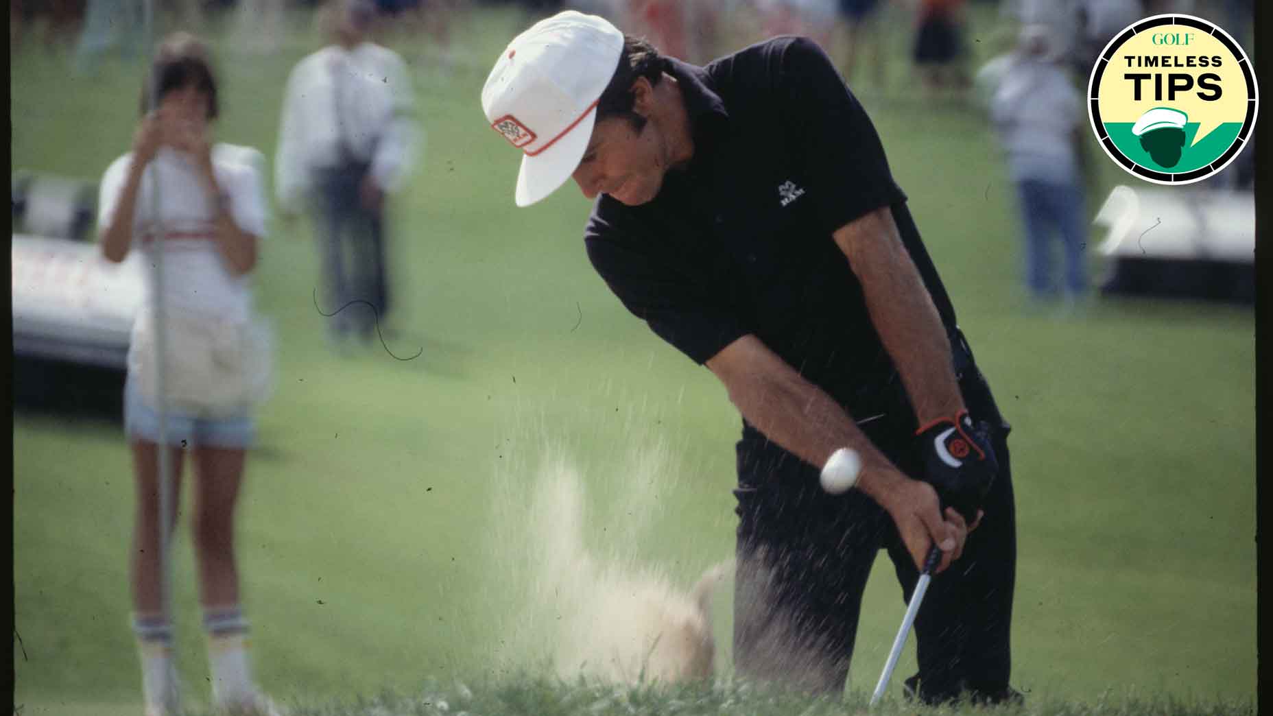 gary player hits shot from fairway bunker