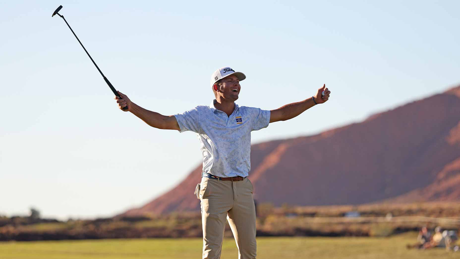 michel brennan hoists putter at Bank of Utah Championship in victory in blue shirt