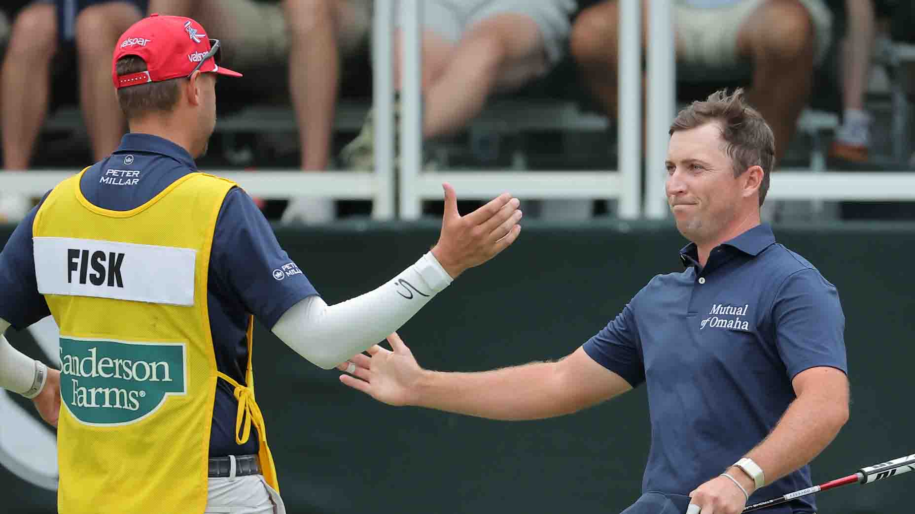 Steven Fisk celebrates with his caddie after winning the 2025 Sanderson Farms Championship