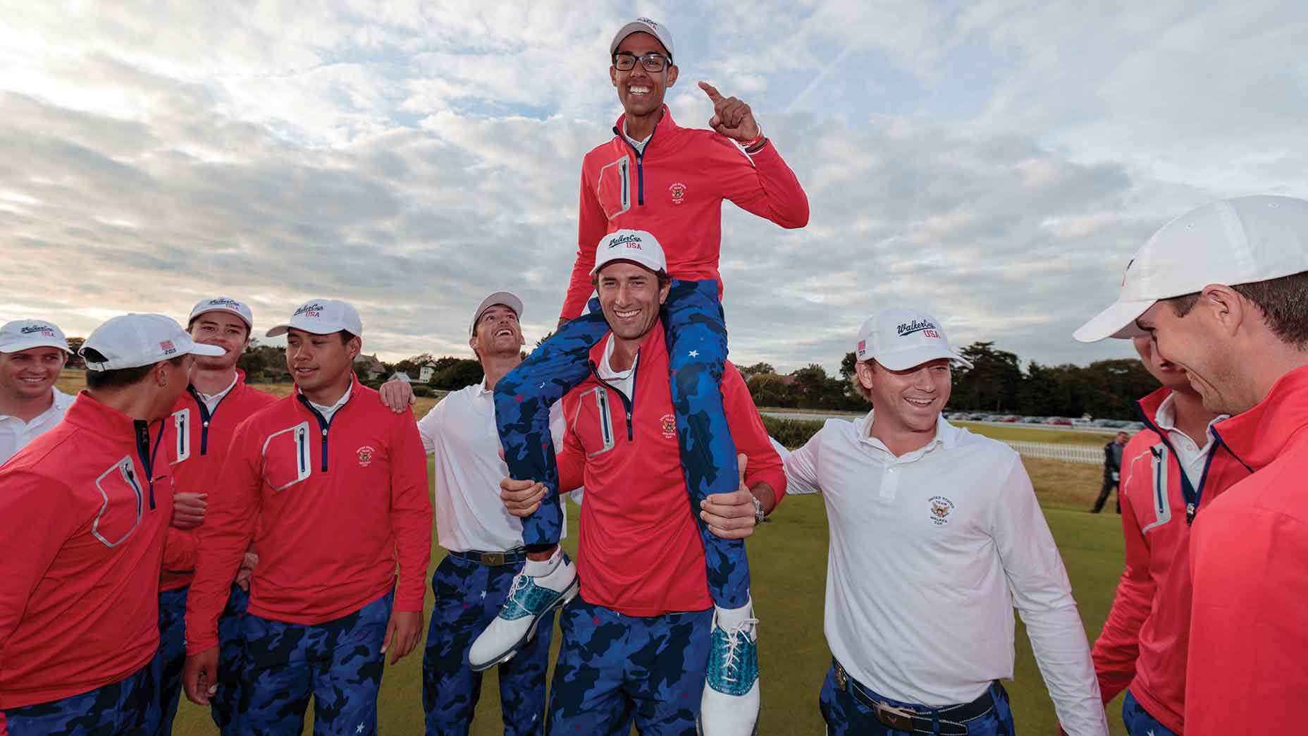 Stewart Hagestad gives teammate Akshay Bhatia a lift at the 2019 Walker Cup.