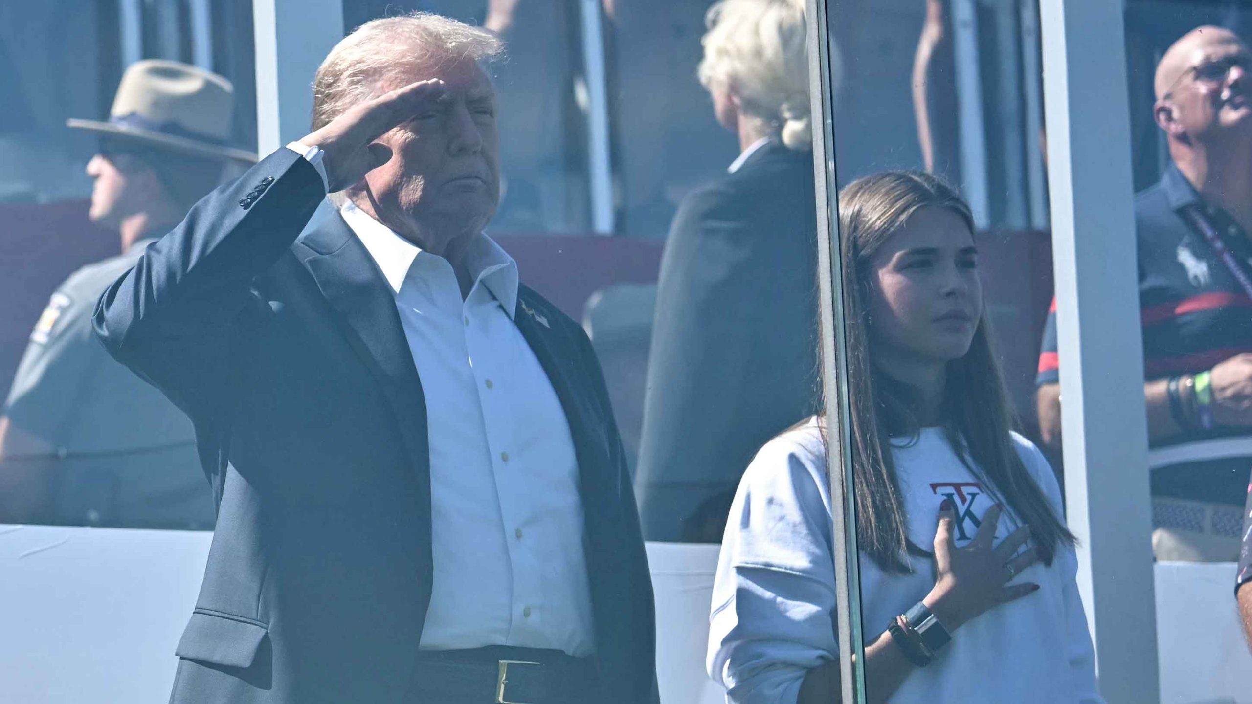 Donald Trump and his grand daughter Kai Madison Trump listen to the national anthem during the 45th Ryder Cup golf competition at Bethpage Black Course