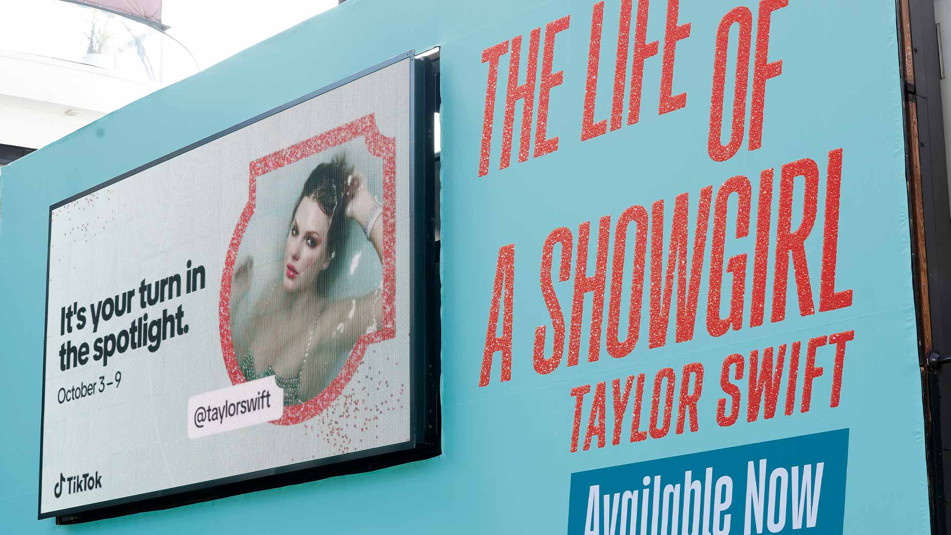 the life of a showgirl album image with tiktok billboard for taylor swift album