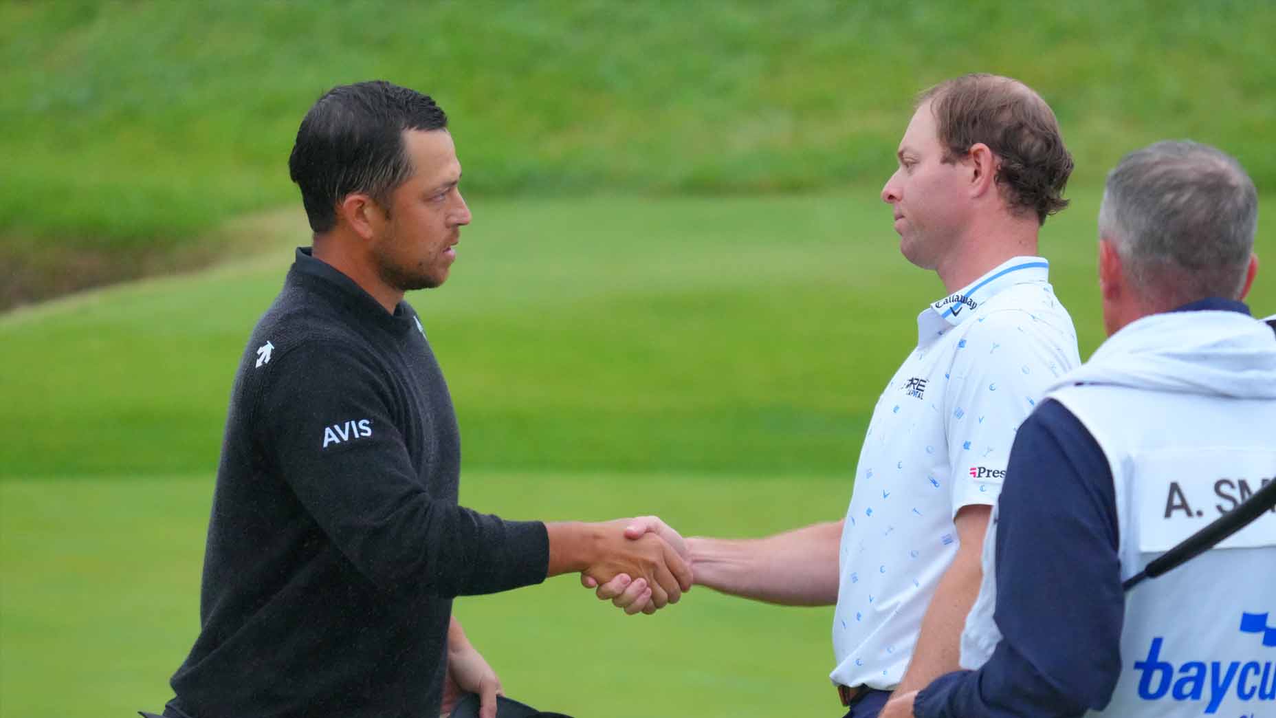 Xander Schauffele and Max Greyserman shake hands after the third round of the Baycurrent Classic