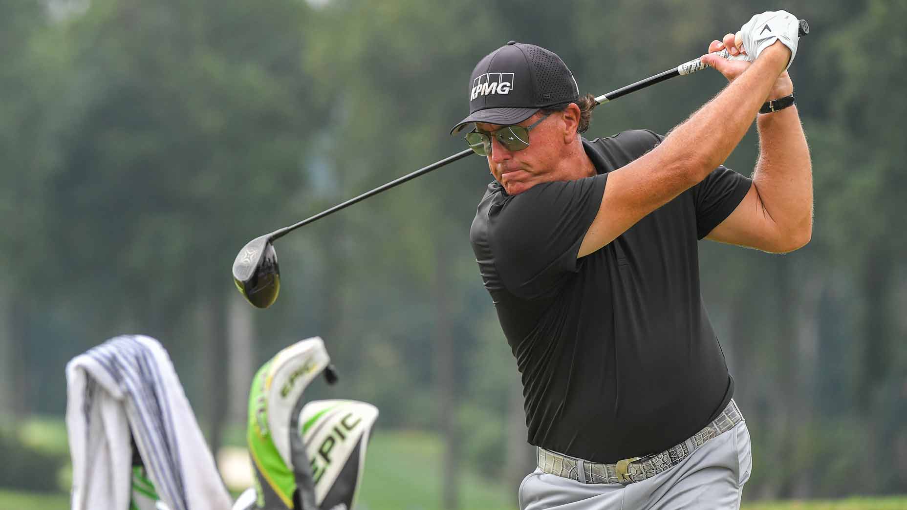 Phil Mickelson swings over his ball on the range during the third round of the BMW Championship at Caves Valley Golf Club on August 28, 2021 in Owings Mills, Maryland.