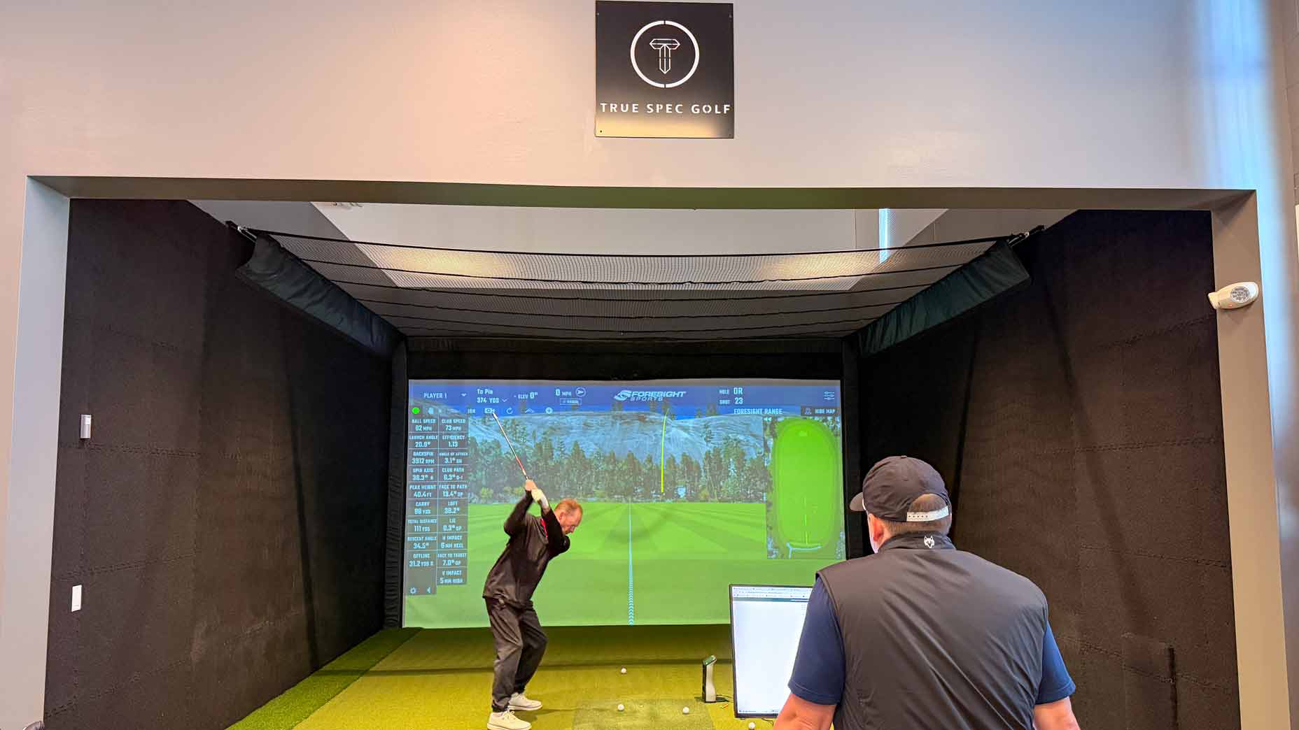 Sam Reef goes through a fitting at True Spec Boston with Brian Gulino.