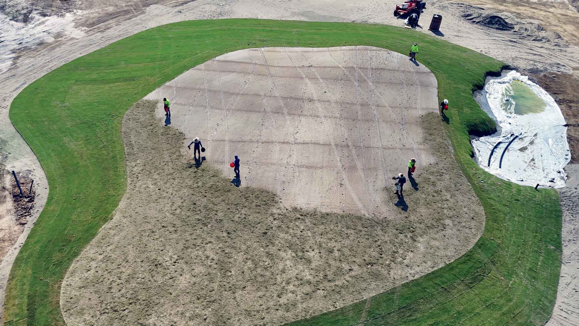 At the King-Collins&ndash;designed Bounty Club, a ground crew sprigs the 14th green.