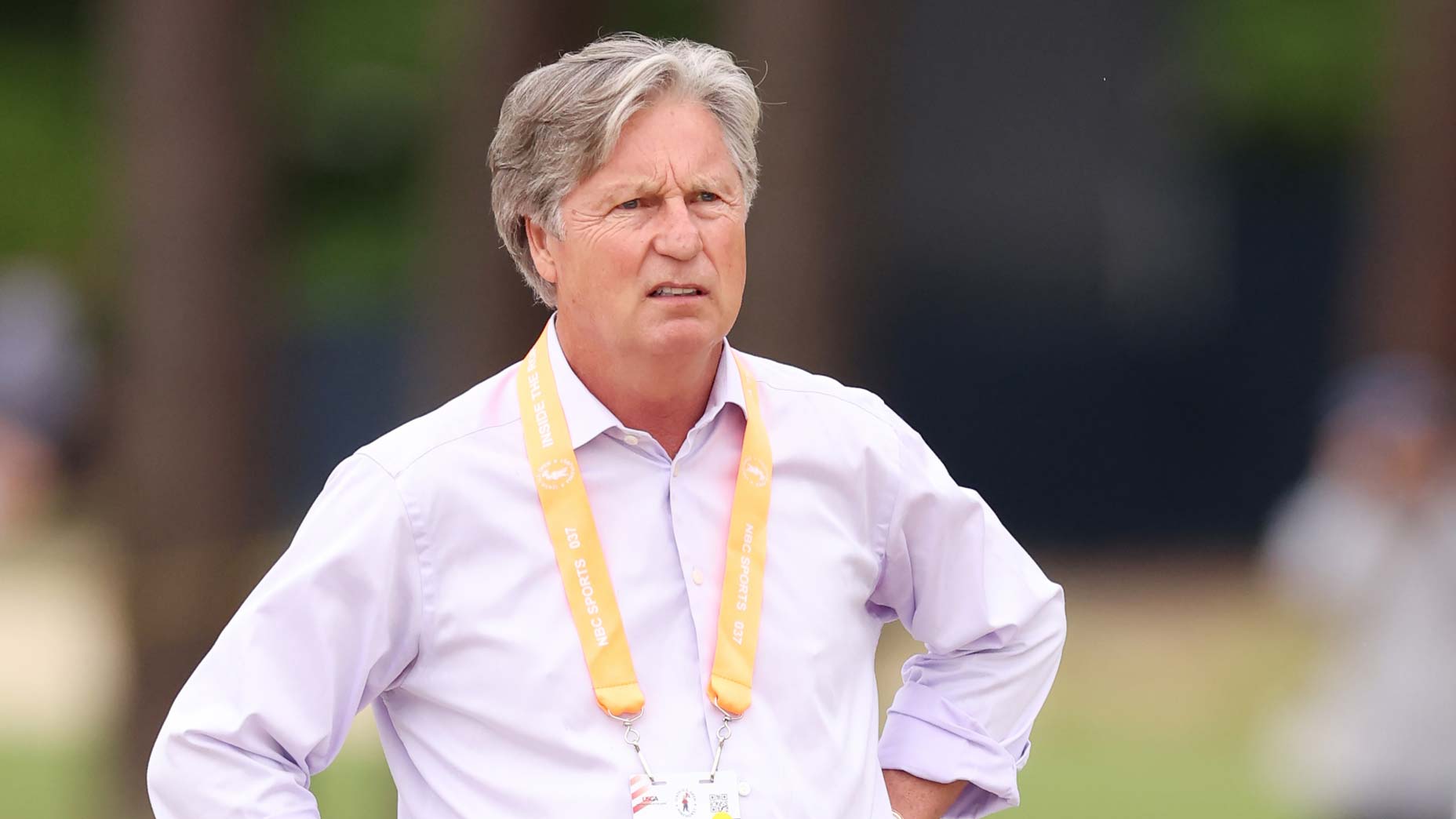 Brandel Chamblee was watching a golf shot in this picture — but you could imagine him gazing towards the new (old) GC logo.